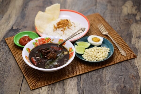 kuliner khas surabaya - nasi rawon, Indonesian black beef soup with rice.